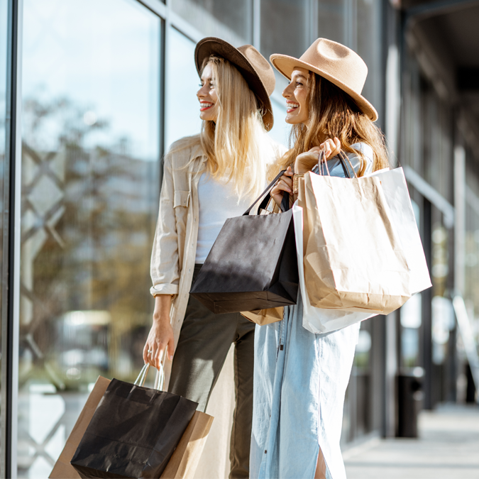 ladies carrying shopping bag